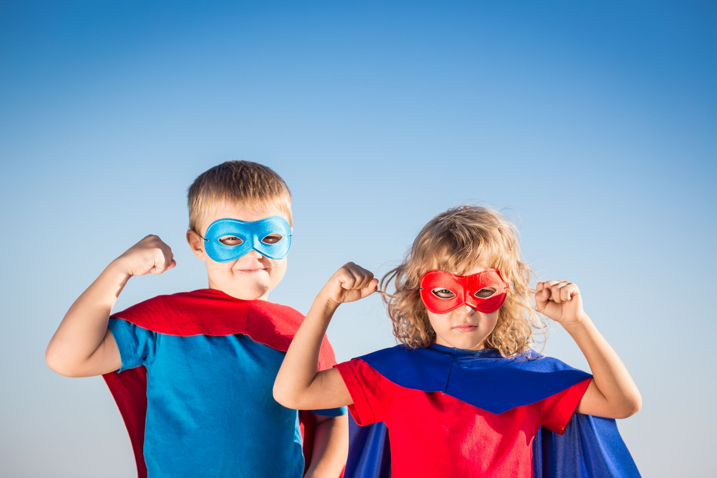 37295599 - superhero children against summer sky background. kids having fun outdoors. boy and girl playing. success and winner concept